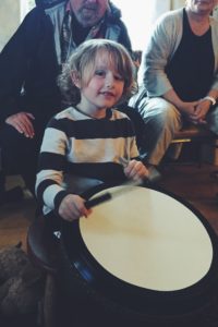 Wisdom child banging drum